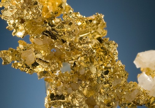 What waste is produced from gold?
